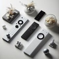 Sleek remote controls with modern designs placed neatly on white
