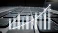 Data analysis visualization with growth graph overlaid on a computer keyboard, illustrating financial success and upward Royalty Free Stock Photo