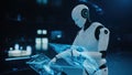 Sleek robot with glowing circuits collaborates with a human on a holographic interface. A metaphor for intelligent