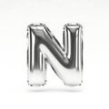A sleek and shiny foil balloon in the shape of the letter n with a reflective surface Royalty Free Stock Photo