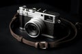 Silver camera with strap on black surface, ai artwork