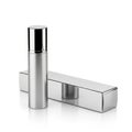 A sleek silver cylindrical object and its matching rectangular box Royalty Free Stock Photo