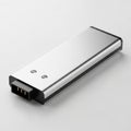 Sleek Silver Electronic Device with USB Connector and Indicator Lights on Gray Surface Royalty Free Stock Photo