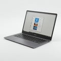 A sleek silver laptop with a thin profile, featuring a black keyboard and trackpad. Royalty Free Stock Photo