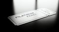Sleek Silver Platinum Ticket on Dark Reflective Surface with Dramatic Lighting Royalty Free Stock Photo