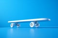 Sleek skateboard frame on a vibrant blue background, a 3D rendering