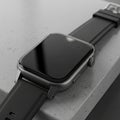 Gray textured surface. The watch displays 10 10 with a glossy Royalty Free Stock Photo