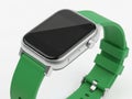 A sleek smartwatch with a green strap and a rectangular black screen Royalty Free Stock Photo