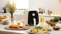 Modern kitchen adorned with an airfryer, epitomizing culinary convenience