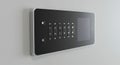 Sleek wall-mounted keypad access panel with a black interface, featuring numeric Royalty Free Stock Photo