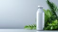 Minimalistic white bottle with green leaves Royalty Free Stock Photo