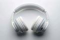 Sleek white headphones arranged neatly on clean white background