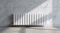 A sleek white heating radiator fixed to a marble wall, lit by soft sunlight, showcasing clean interior design Royalty Free Stock Photo
