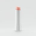 A sleek, white lipstick tube with a minimalist design is centered against a plain white Royalty Free Stock Photo