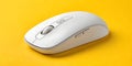 Sleek white wireless computer mouse on vibrant yellow background, modern tech accessory Royalty Free Stock Photo