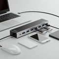 A sleek workstation setup with a USB hub. The hub features multiple USB ports,
