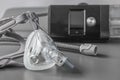 Sleep apnea CPAP mask on the grey table