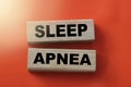 Sleep apnea words on wooden blocks. Sleep disorders healthcare concept Royalty Free Stock Photo