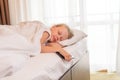 Sleep girl phone mobile beautiful young bed blanket view morning, concept caucasian pillow from people for home rest Royalty Free Stock Photo