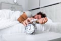 Sleep longer. Health care concept. Stages of sleep. Man awake unhappy with alarm ringing. Although you sleep you may wake up