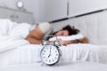 Sleep longer. Health care concept. Stages of sleep. Man awake unhappy with alarm ringing. Although you sleep you may wake up