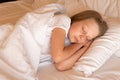 Sleep young phone mobile beautiful girl bed blanket eyes morning, from female cell for dream for smile bedding, room Royalty Free Stock Photo
