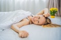 Sleep without a pillow. Young Woman Sleeping In Bed without a pillow. Portrait Of Beautiful Female Resting On Royalty Free Stock Photo