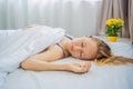 Sleep without a pillow. Young Woman Sleeping In Bed without a pillow. Portrait Of Beautiful Female Resting On Royalty Free Stock Photo