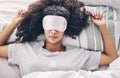 Sleep, relax and black woman in bed with eye mask, dream and rejuvenate body and mind in apartment or hotel. Dreaming Royalty Free Stock Photo