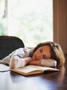 Sleep, remote worker and tired woman with books, fatigue or snooze while writing in home office. Freelance, burnout or Royalty Free Stock Photo