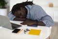 Sleep At Work. Tired African American Man Napping At Desk With Laptop Royalty Free Stock Photo