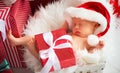 Sleeper newborn baby in Christmas Santa cap Royalty Free Stock Photo