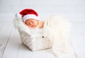 Sleeper newborn baby in Christmas Santa cap Royalty Free Stock Photo