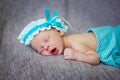 Sleeper newborn baby, gray background Royalty Free Stock Photo