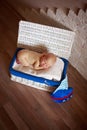 Sleeper newborn baby in white box