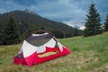 Sleepin bag in open inner tent body without rainfly, on mountain col in grass in the morning. On background Velky Rozsutec. Mala Royalty Free Stock Photo