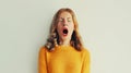 Sleepiness. Young tired woman yawns opens her mouth wide