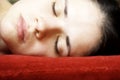 Sleeping woman on a red pillow Royalty Free Stock Photo