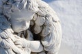 Sleeping angel statue.Angel guardian sleeping in white snow background Royalty Free Stock Photo