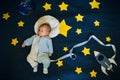 Sleeping baby boy astronaut on a background of the sky Royalty Free Stock Photo