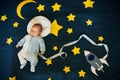 Sleeping baby boy on a background of the starry sky