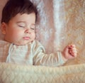 Sleeping baby covered with knitted blanket Royalty Free Stock Photo