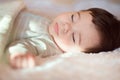 Sleeping baby covered with knitted blanket Royalty Free Stock Photo