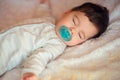 Sleeping baby covered with knitted blanket Royalty Free Stock Photo