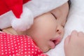 Sleeping baby girl Santa Claus Royalty Free Stock Photo