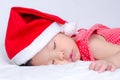 Sleeping baby girl Santa Claus Royalty Free Stock Photo