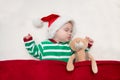 Sleeping baby girl Santa Claus. Royalty Free Stock Photo