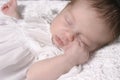 Sleeping Baby Girl in White Dress