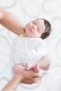 Sleeping baby in her arms. Father holding her newborn baby daughter after birth on arms., Concept of love and family., Newborn Royalty Free Stock Photo