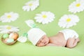 Sleeping baby infant as rabbit and Easter eggs Royalty Free Stock Photo
